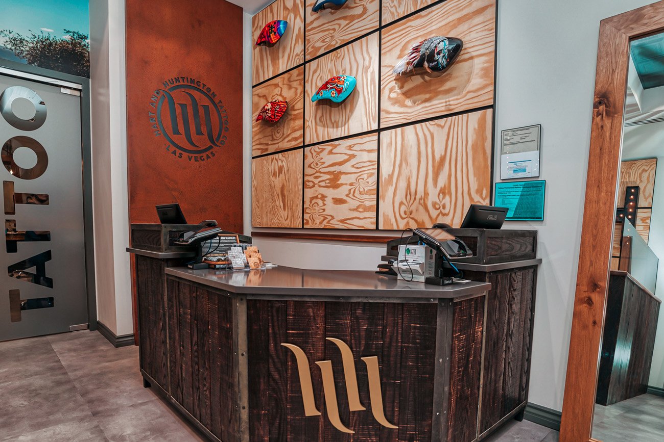 View of our custom painted motorcycle gas tanks behind our staff counter at H&amp;H Las Vegas